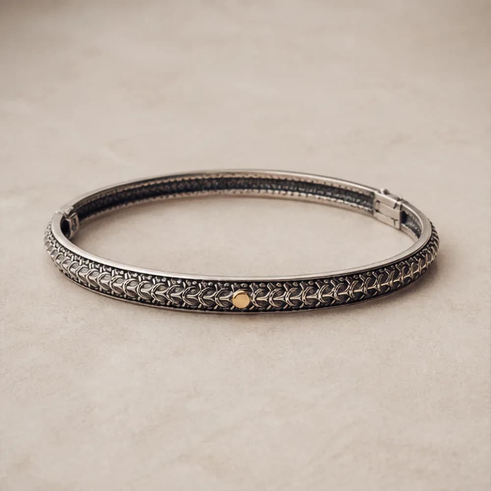 Archive Cuff shown alone — oxidized recycled silver · 14k gold